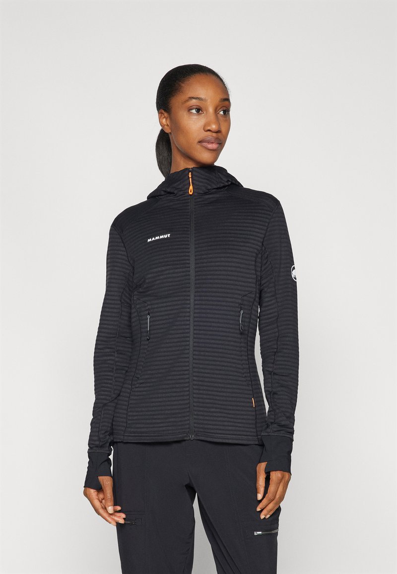 Black hooded jacket with ribbed texture and front zipper. Features two side pockets, thumbholes, and contrasting orange accents.