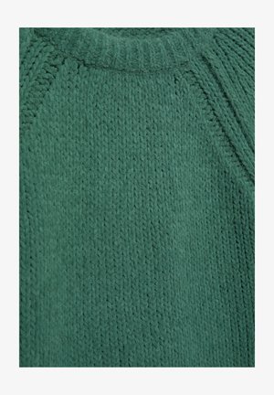 Zelený pletený sveter s textúrovaným žebrovaným vzorom. Má okrúhly výstrih a raglánové rukávy. Jemná a hrubá látka.