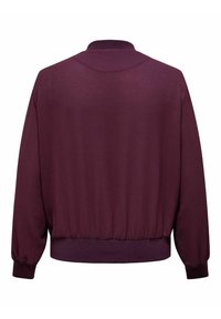 Burgundi värvi pullover-jakk tekstuurse viimistlusega, soonikservade ja -mansettidega ning ümar kaelus, millel on lõdvestatud lõige ja pikad varrukad.