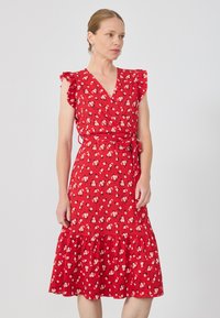 Red floral wrap dress with ruffled sleeves, a v-neckline, and a tiered hem. Material is lightweight, featuring small white and pink flowers.