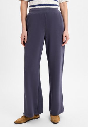 Wide-leg pants in dark purple fabric, featuring a smooth texture and elastic waistband. No visible patterns or hardware details.