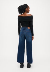 ONLY Petite ONLMADISON BLUSH WIDE - Wide leg - dark blue denim