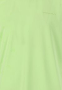 Neongrön sportstopp med ett strukturerat, lätt tyg. Har ordet "ENDURANCE" tryckt diskret i en ljus nyans.