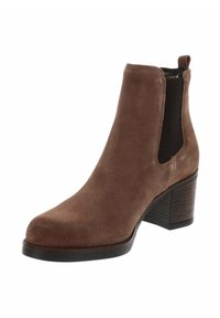 Bottines en suède marron avec un talon bloc, panneaux élastiques latéraux noirs et une languette à l'arrière.