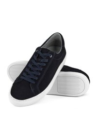 Navy suede sneakers with white rubber soles, featuring a rounded toe, tonal laces, and contrasting stitching details on the upper.