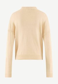 Knit sweater in light beige with a collar, long sleeves, and ribbed cuffs. Features a textured fabric and a cropped design.