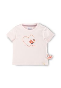 Light pink short-sleeve T-shirt made of cotton. Features a red heart outline and a cartoon ladybug graphic. Includes a ladybug tag detail.