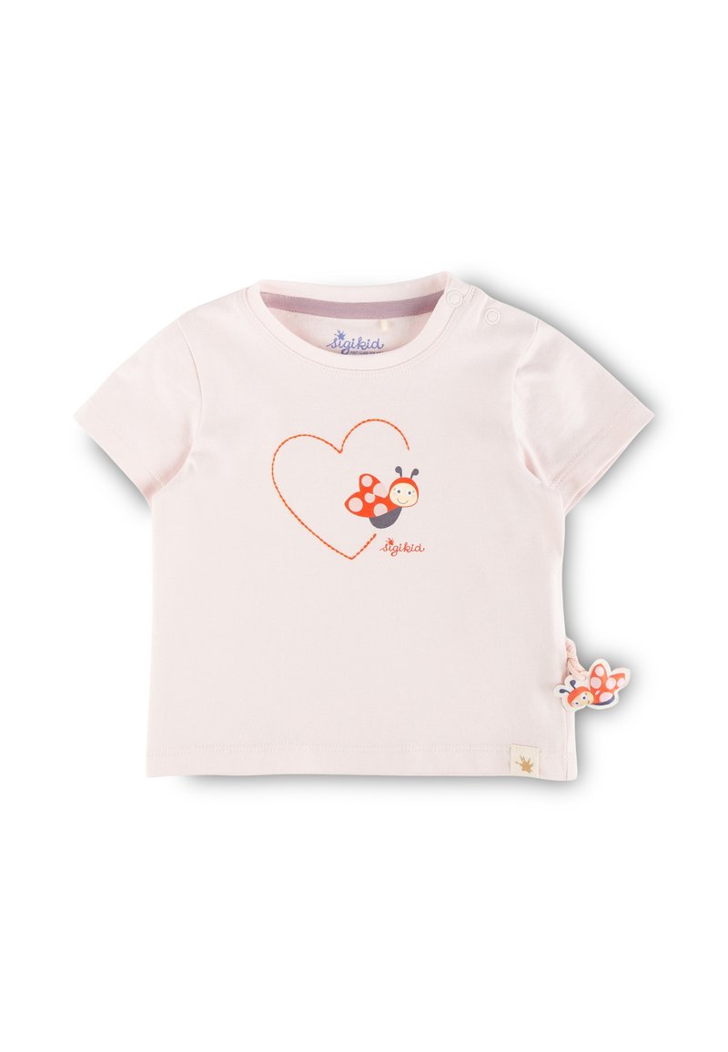Light pink short-sleeve T-shirt made of cotton. Features a red heart outline and a cartoon ladybug graphic. Includes a ladybug tag detail.