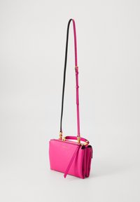 Pink leather crossbody bag with a structured design, gold hardware, and a detachable strap. Features pleated accents and a zip closure.