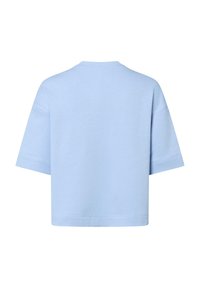 T-shirt in cotone azzurro chiaro, a maniche corte, con una vestibilità ampia, scollatura rotonda e orlo pulito. Design semplice senza motivi o dettagli.
