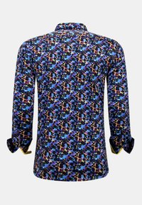 Overhemd met lange mouwen en een kleurrijk patroon van cirkels in blauw, roze en zwart, met een klassieke kraag en knoopmanchetten.