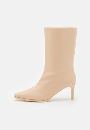 Klassiska stövletter - beige