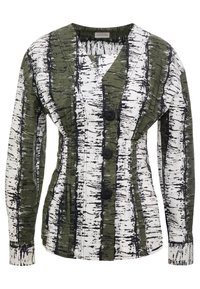 Blouse à motifs verts et blancs avec un décolleté en V, des manches longues et trois boutons noirs sur le devant, en tissu texturé.