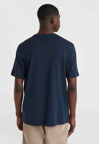 Navy blue short-sleeve t-shirt with a crew neck, made of soft cotton, features a relaxed fit and smooth texture. Visible stitching detail.