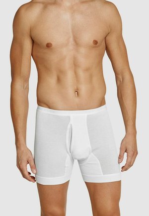 White cotton boxer briefs with ribbed texture, elastic waistband labeled "SCHIESSER," and a front opening detail.