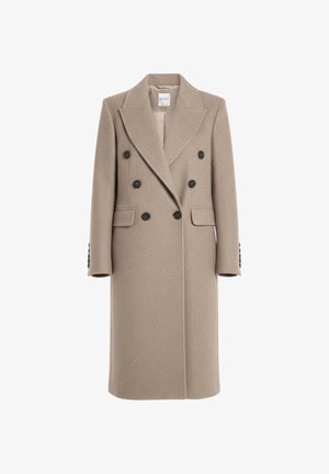 Doppelreiher-Mantel aus lichtbeigem Stoff mit strukturierter Oberfläche. Verfügt über große schwarze Knöpfe, Reverskragen und Seitentaschen.