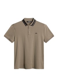 Beżowa koszulka polo z krótkim rękawem, z podwójnymi czarnymi paskami na kołnierzyku i małym czarnym logo na lewej piersi.