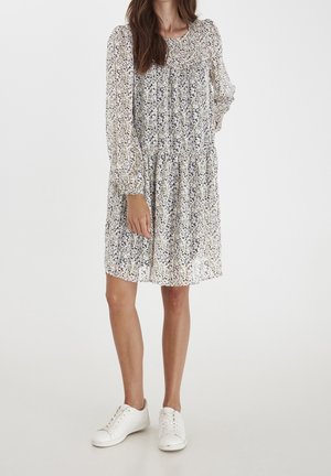 Blumenkleid in Kniehöhe mit langen, gepufften Ärmeln aus leichtem Stoff; verfügt über einen gerafften Taillenbund und eine Mischung aus blauen und lila Mustern.
