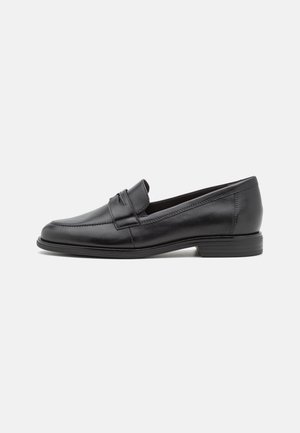 Black leather loafers with a smooth finish, rounded toe, and stitching details. Low stacked heel and minimalistic design.