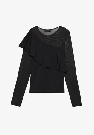 Black long-sleeve top featuring a textured mesh fabric and a flowing ruffle detail across one shoulder, with a round neckline.