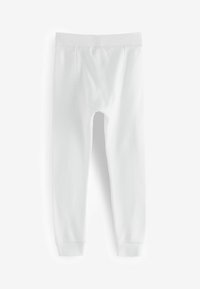 Witte geribbelde leggings met een aansluitend ontwerp, voorzien van een elastische tailleband en omslagranden, gemaakt van zacht katoen.