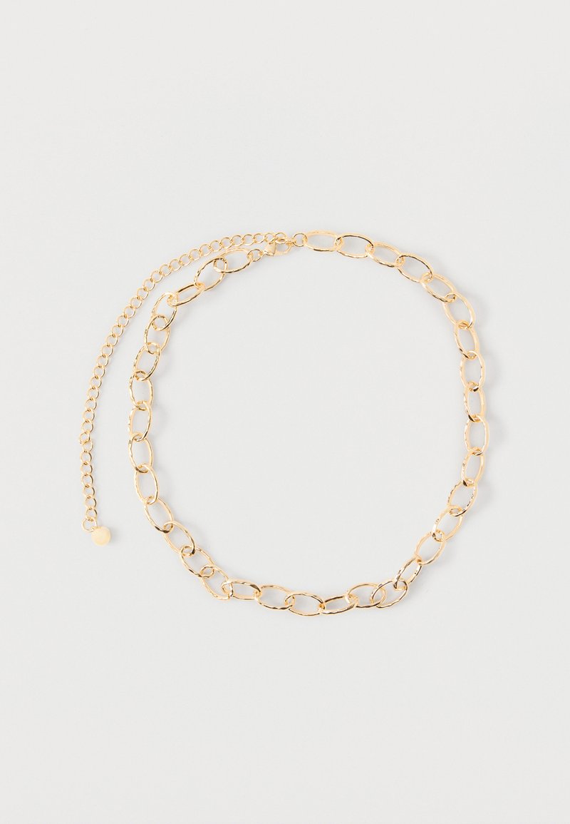 Χρυσό κολιέ αλυσίδα με επιμηκυμένους οβάλ κρίκους και ρυθμιζόμενη επέκταση, παρουσιάζεται σε απλό ανοιχτό φόντο.