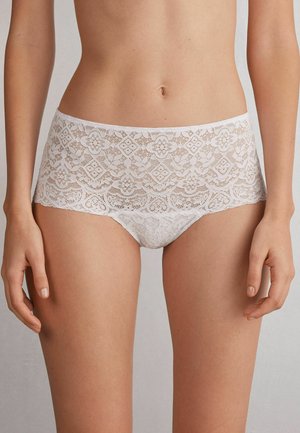 White lace hipster underwear featuring intricate floral patterns, a soft texture, and a seamless elastic waistband for comfort.