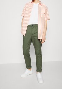 Tommy Jeans Chinos - olive