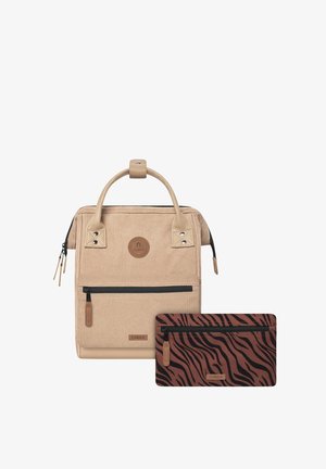 Brown corduroy backpack with a rectangular shape, featuring a top handle, zippered front pocket, and removable brown and black striped pouch.