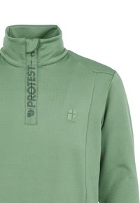 Pullover in pile verde con colletto alto, zip frontale a metà e un discreto logo. Tessuto liscio e leggero per il massimo comfort.