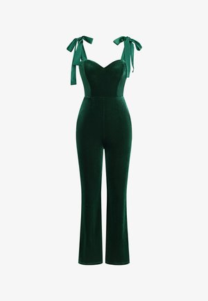 Groene fluwelen jumpsuit met een sweetheart-halslijn, uitlopende pijpen en decoratieve strikbandjes. Zachte textuur met een gladde afwerking en een aansluitend lijfje.