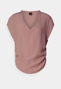 Blusa a maniche corte con scollatura a V in morbido tessuto rosa chiaro, dal taglio rilassato. Presenta delicate arricciature sulla spalla e una texture liscia.