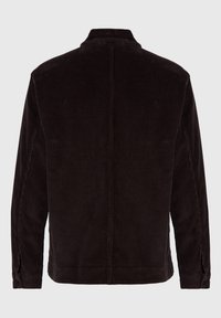 Mörkbrun kordjacka med långa ärmar, synliga sömmar och ståkrage, sedd bakifrån mot en ljus bakgrund.