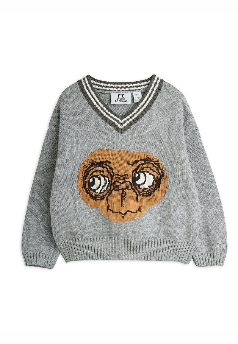 Γκρίζα πλεκτή ζακέτα με μεγάλη γραφική απεικόνιση του προσώπου του E.T. σε καφέ χρώμα. V-νέκη με σκούρες ριγέ λεπτομέρειες. Ριμπ εσωτερικές μανσέτες και στρίφωμα. Μαλακή υφή.