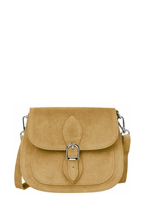 Suede crossbody bag in light tan with a curved flap, decorative leaf-shaped accent, and silver-tone hardware. Adjustable strap included.