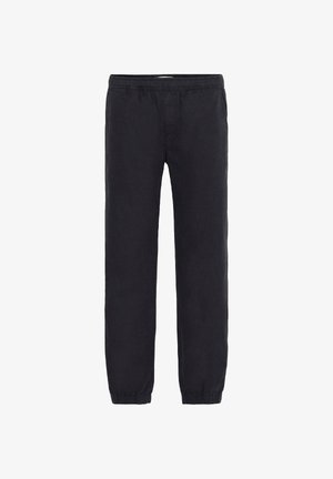 Pantalones de algodón negros con una cintura elástica y puños ajustados. La tela tiene una textura suave y un corte holgado, adecuado para uso casual.