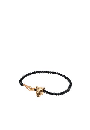 Pulsera de cuentas negras con un charm de cabeza de leopardo dorado, que presenta detalles faciales y un cierre tipo broche.