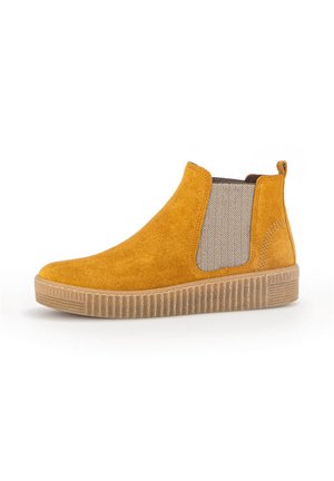 Yellow suede ankle boots with elastic side panels in a herringbone pattern, textured rubber sole, and pull tab on the heel.