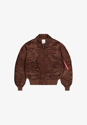 Braune Nylon-Bomberjacke mit Frontreißverschluss, zwei großen Fronttaschen, gerippten Bündchen und Saum, Aufnäher auf der Brust und Reißverschlusstasche am Ärmel mit rotem Etikett.