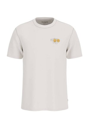 T-shirt beige chiaro a maniche corte con scollo rotondo e piccolo motivo grafico di due monete d'oro e un timbro postale sul petto sinistro.