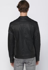 Koroshi Giacca in similpelle - black