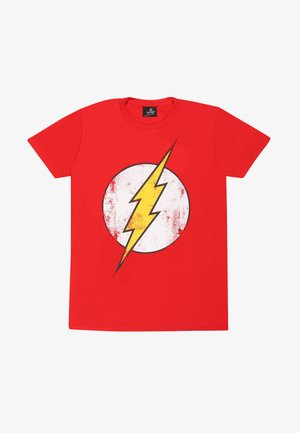 T-shirt en coton rouge avec un grand cercle blanc usé au centre affichant un design d'éclair jaune. Manches courtes et col rond.