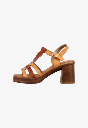 Brown and orange strappy sandals with a chunky heel, made of leather with a smooth texture and a looped design at the front.