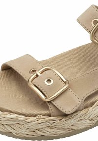 Sandal con piattaforma beige con due cinturini regolabili, fibbie in tonalità oro e suola intermedia in juta intrecciata. Texture morbida con suola in gomma piatta.