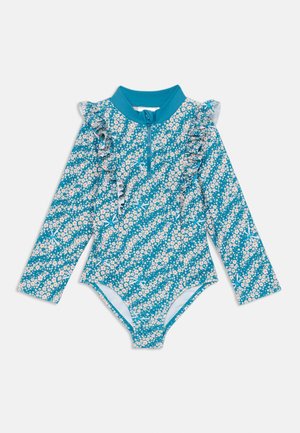 Maiô de mangas longas com um padrão floral turquesa, gola e punhos com frufru e um zíper frontal para fecho. Apresenta um forro interior suave.