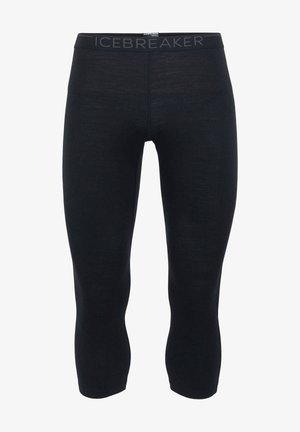 Schwarze knielange Leggings aus leichtem Material mit weicher Textur und körperbetontem Schnitt. Bandlogo am Bund.