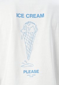 White t-shirt featuring a blue graphic of an ice cream cone, with melting ice cream and the text "ICE CREAM PLEASE" below the design.