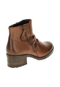 Brown leather ankle boot with a slouchy design, side zipper, and a wooden block heel. The sole features traction detailing.