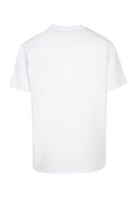 White cotton T-shirt featuring a crew neckline and short sleeves. The back is plain with no patterns or embellishments.