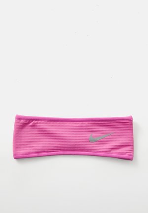 Pink athletic headband made of textured fabric with a stretchy design. Features a small silver Nike logo on one side.
